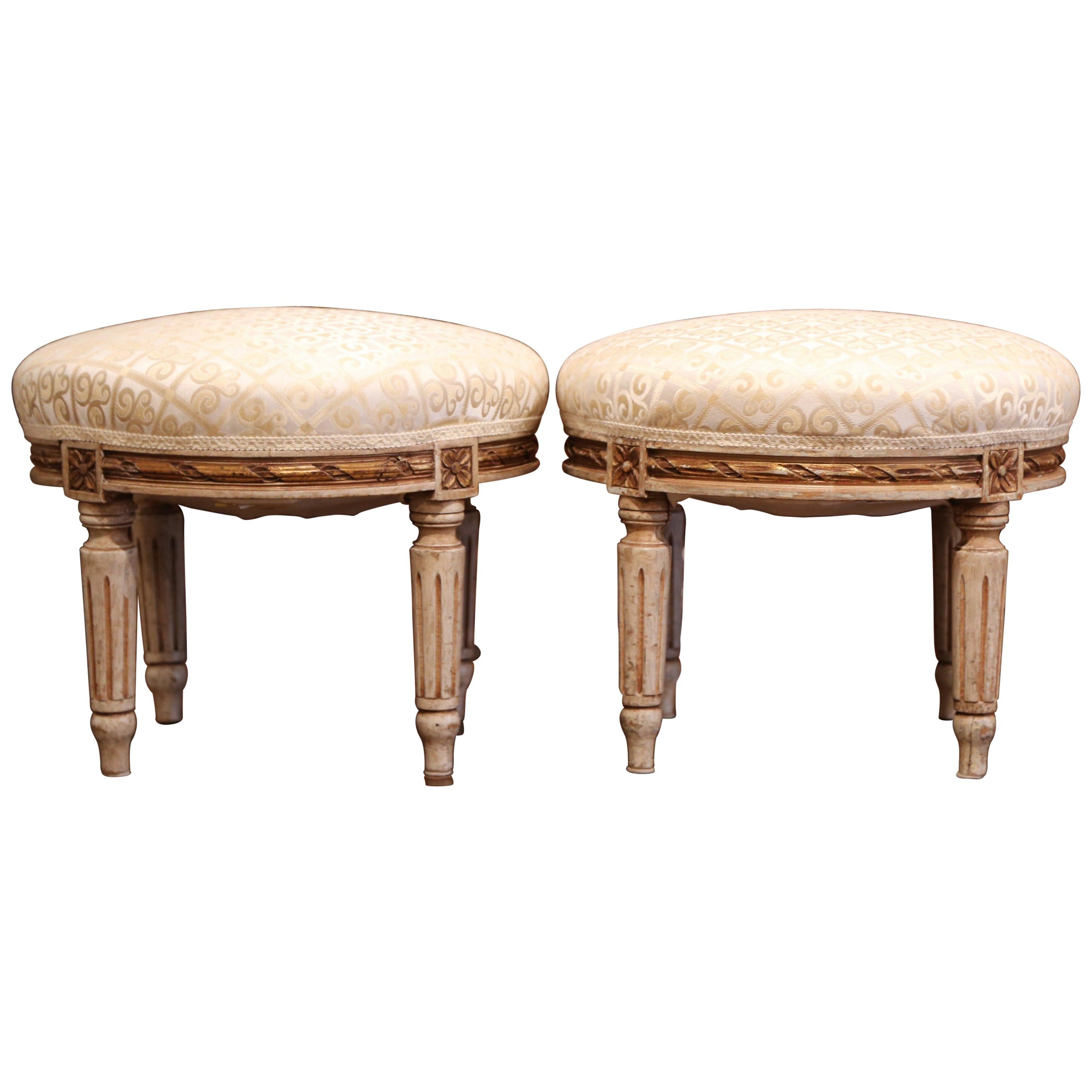 Pair of Early 20th Century French Louis XVI Carved Painted and Gilt Footstools