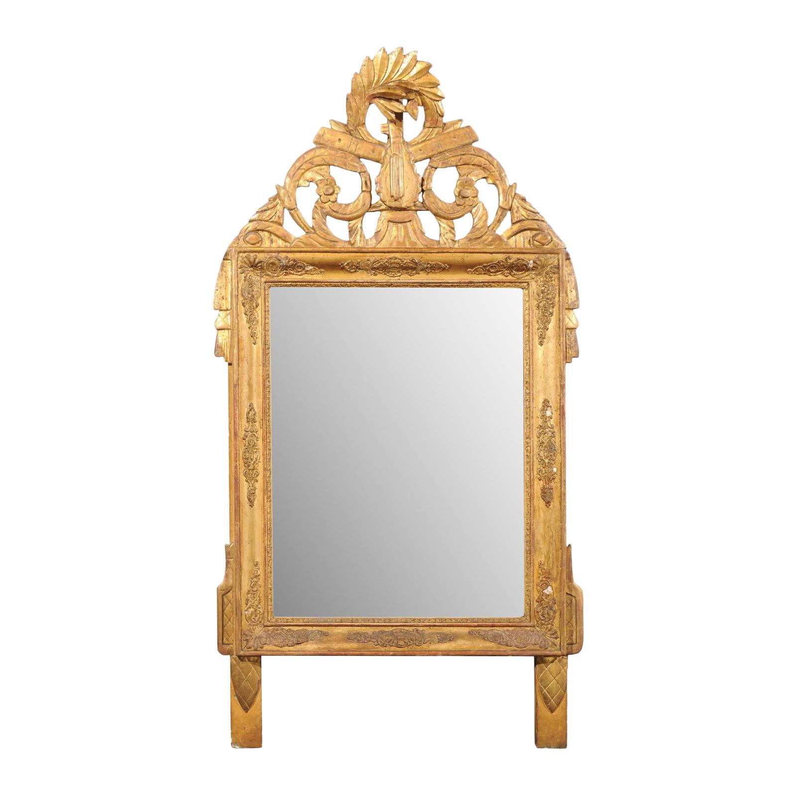 French Louis XV Style Giltwood Mirror with Hand Carved Liberal Arts Symbols For Sale