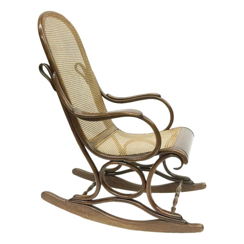 Bended beechwood rocking chair with rattan seat, circa 1900 For Sale