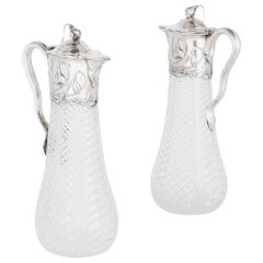 Two Art Nouveau Silver and Cut Glass Claret Jugs by Wilhelm Binder