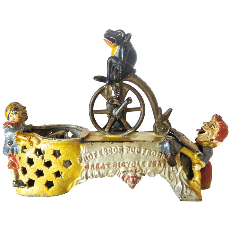 "Professor Pug Frog Great Bicycle Feat" Mechanical Bank, American, circa 1886 For Sale