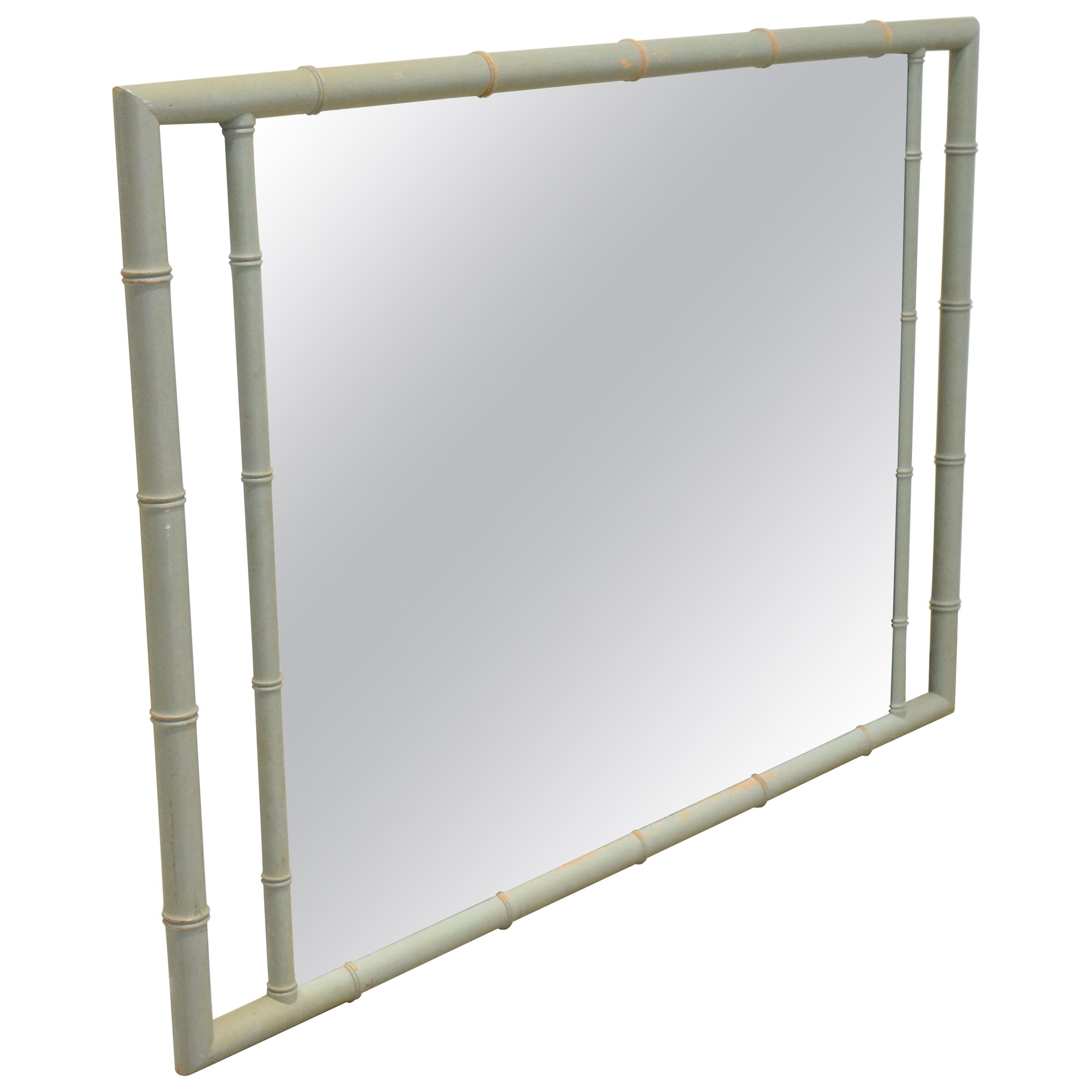 Large faux bamboo mirror by Kittinger. Signed to back with manufacturer's stamp and sticker.