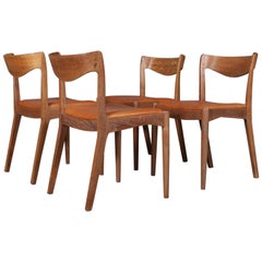 Set of Four Ib Kofod-Larsen Dining Chairs Oak and Aniline Leather, Denmark 1950s
