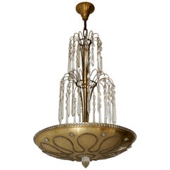 Chandelier in Gilded Metal and Crystal