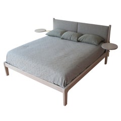 Lapwing Bed with Pivoting Side Tables and Upholstered Headboard in Maple