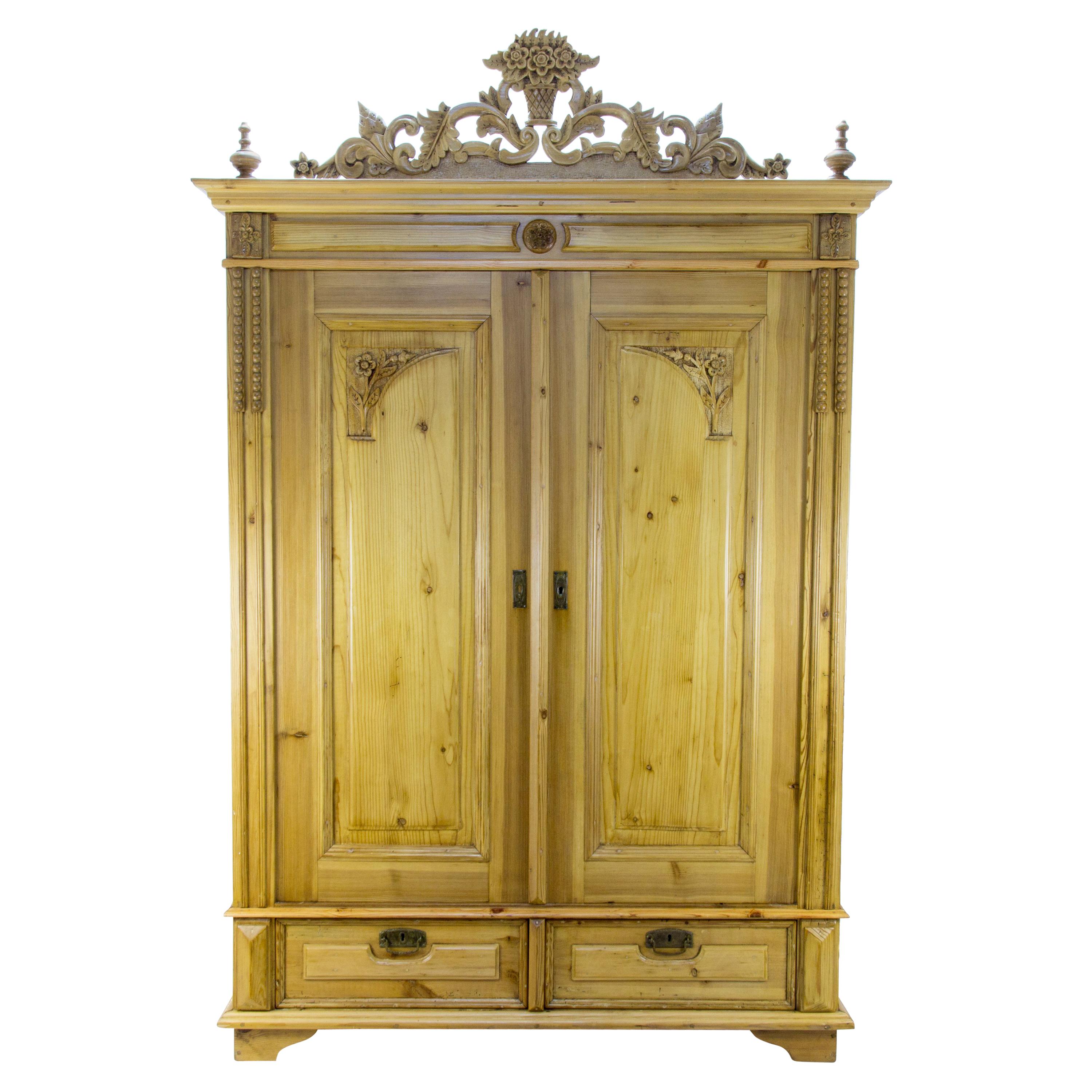 Baltic Pine Two-Door Armoire with Carved Flower Crown, 1920s