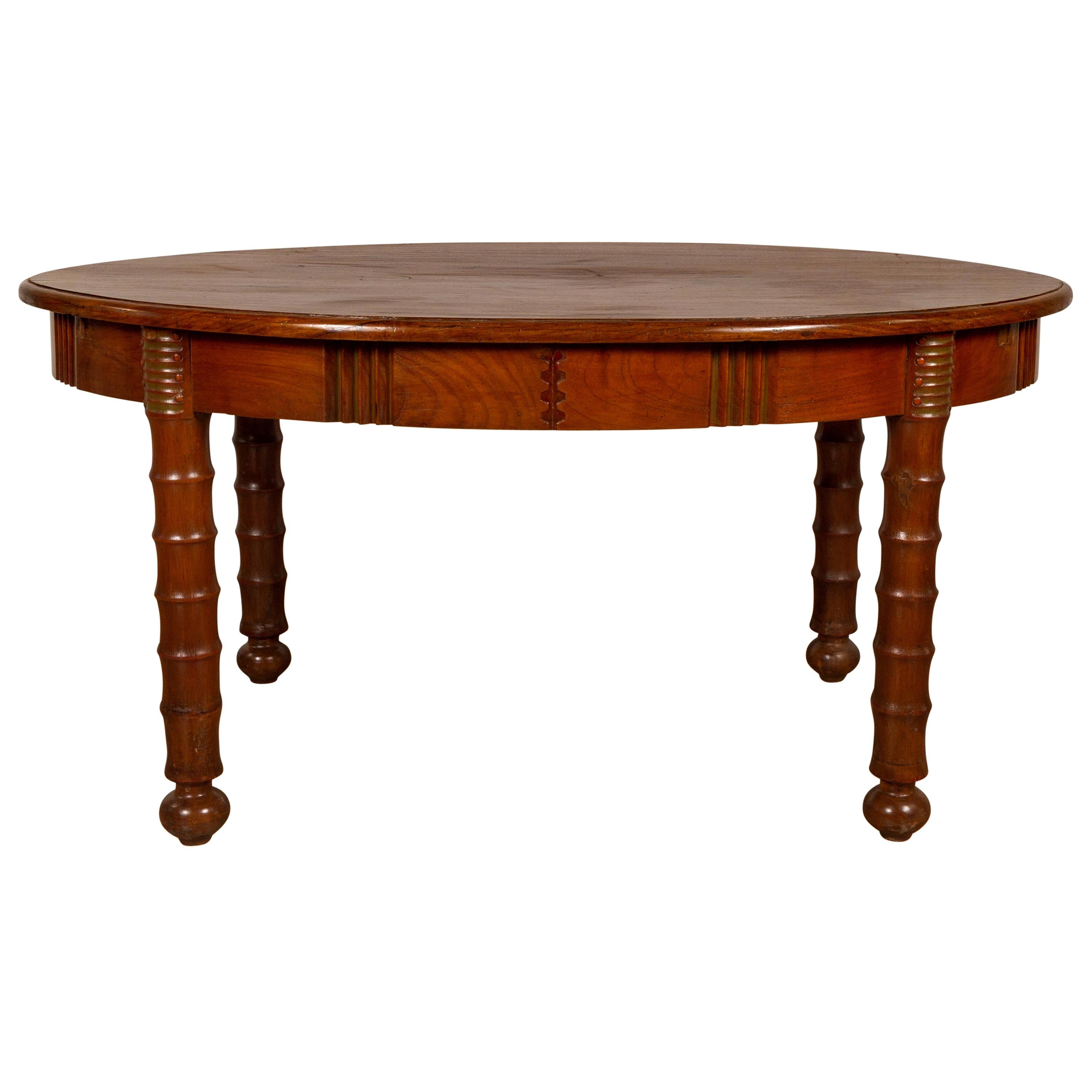 Antique Oval Dining Room Table from Indonesia with Spindle Legs and Warm Patina For Sale