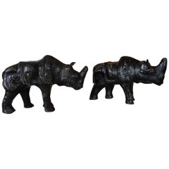 Rare and Small Pair of Black Rhino Sculptures Leather on Wood with Glass Eyes