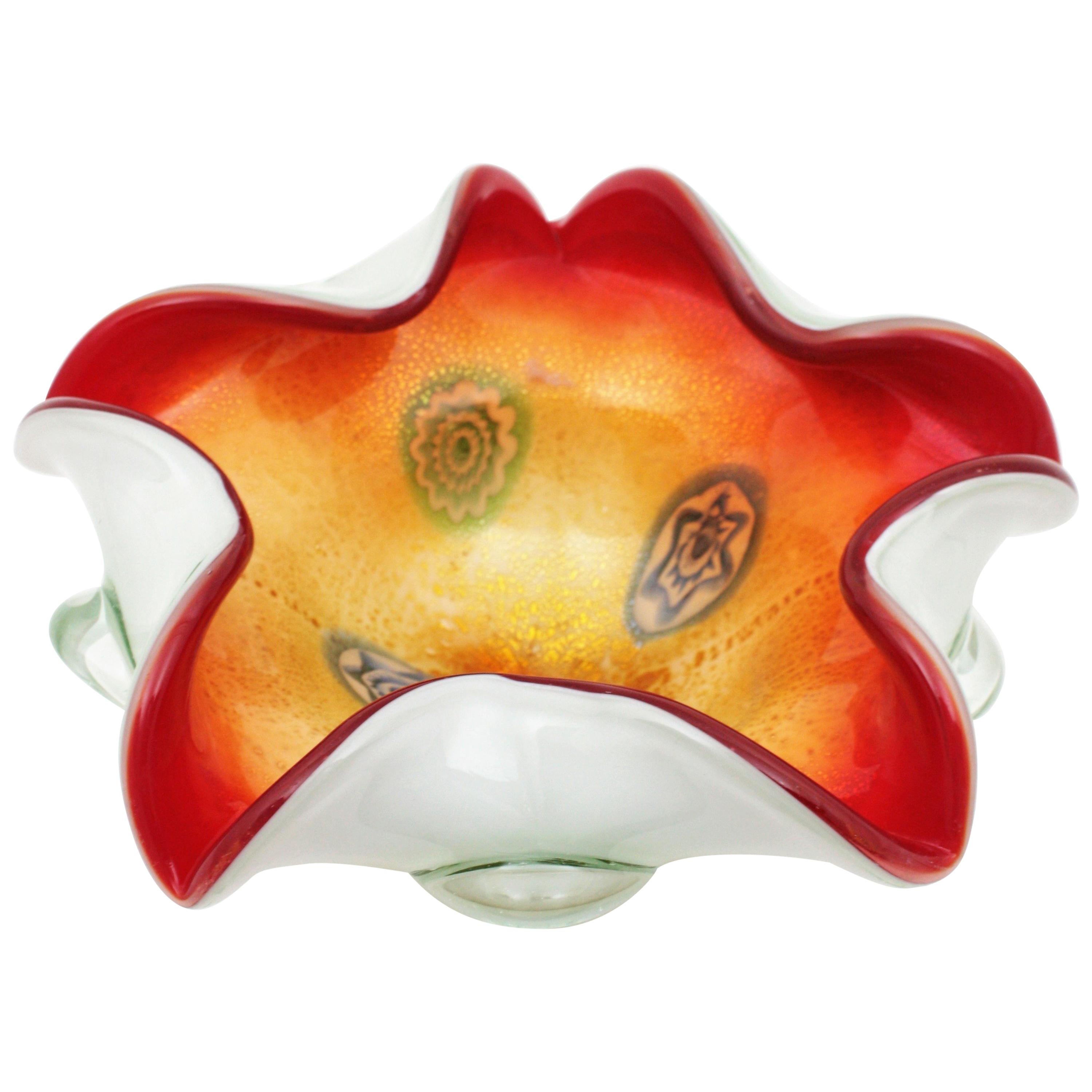 Italian Mid-Century Modern hand blown Murano art glass flower shaped centerpiece or bowl with Murrine decorations and aventurine gold and silver flecks. Attributed to Aldo Nason and manufactured by Arte Vetraria Muranese, AVEM.
Aldo Nason was one