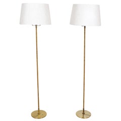 Paavo Tynell Pair of Floor Lamps in Brass and Cane for Taito, Model 9627, 1950s