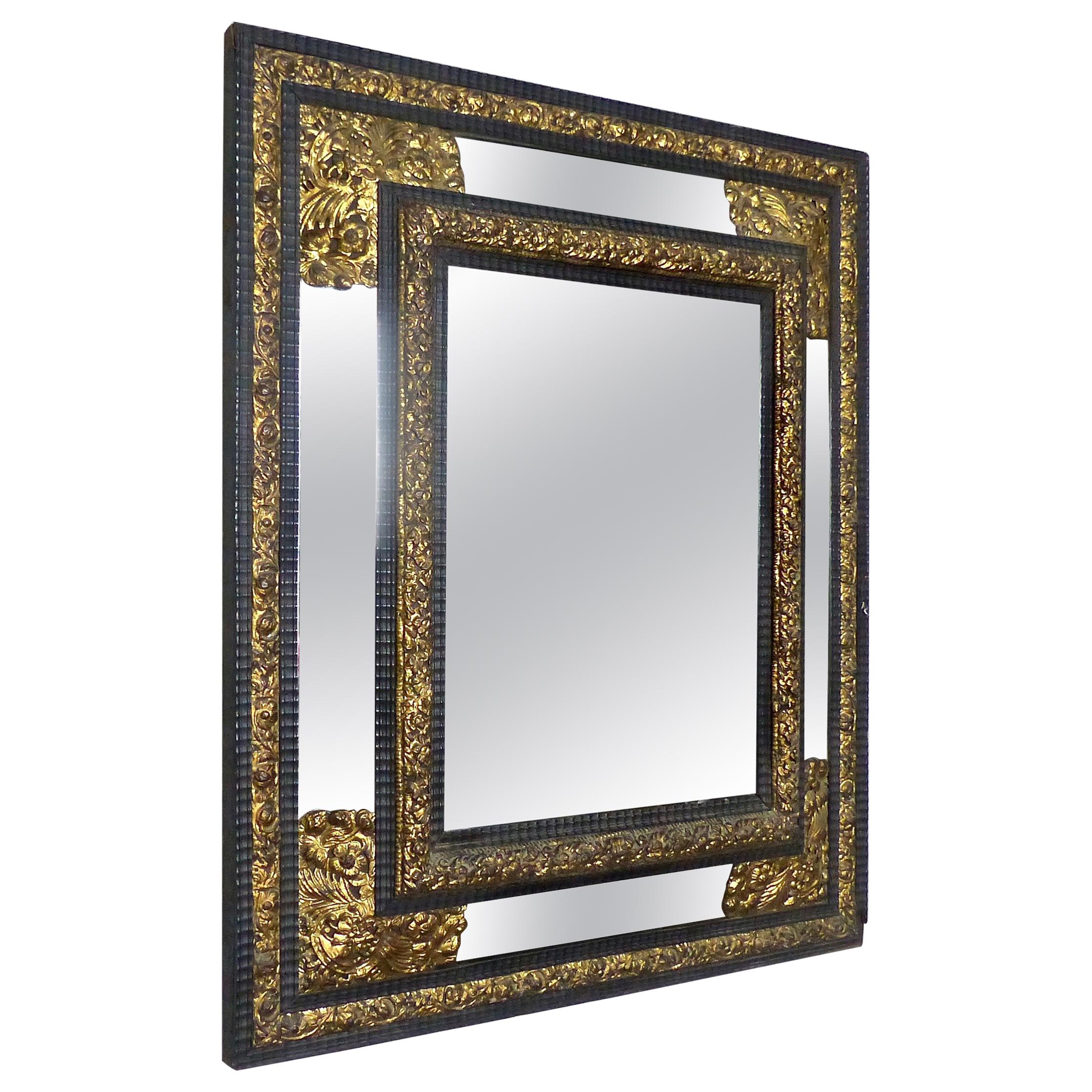 19th Century French Ebony Mirror with Gilt Repousse Brass