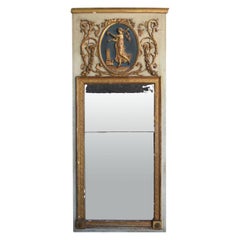 Miroir Trumeau en bois laqué et doré d'époque Empire du début du XIXe siècle