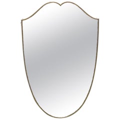 Midcentury Italian Brass Shield Form Mirror in the Manner of Gio Ponti