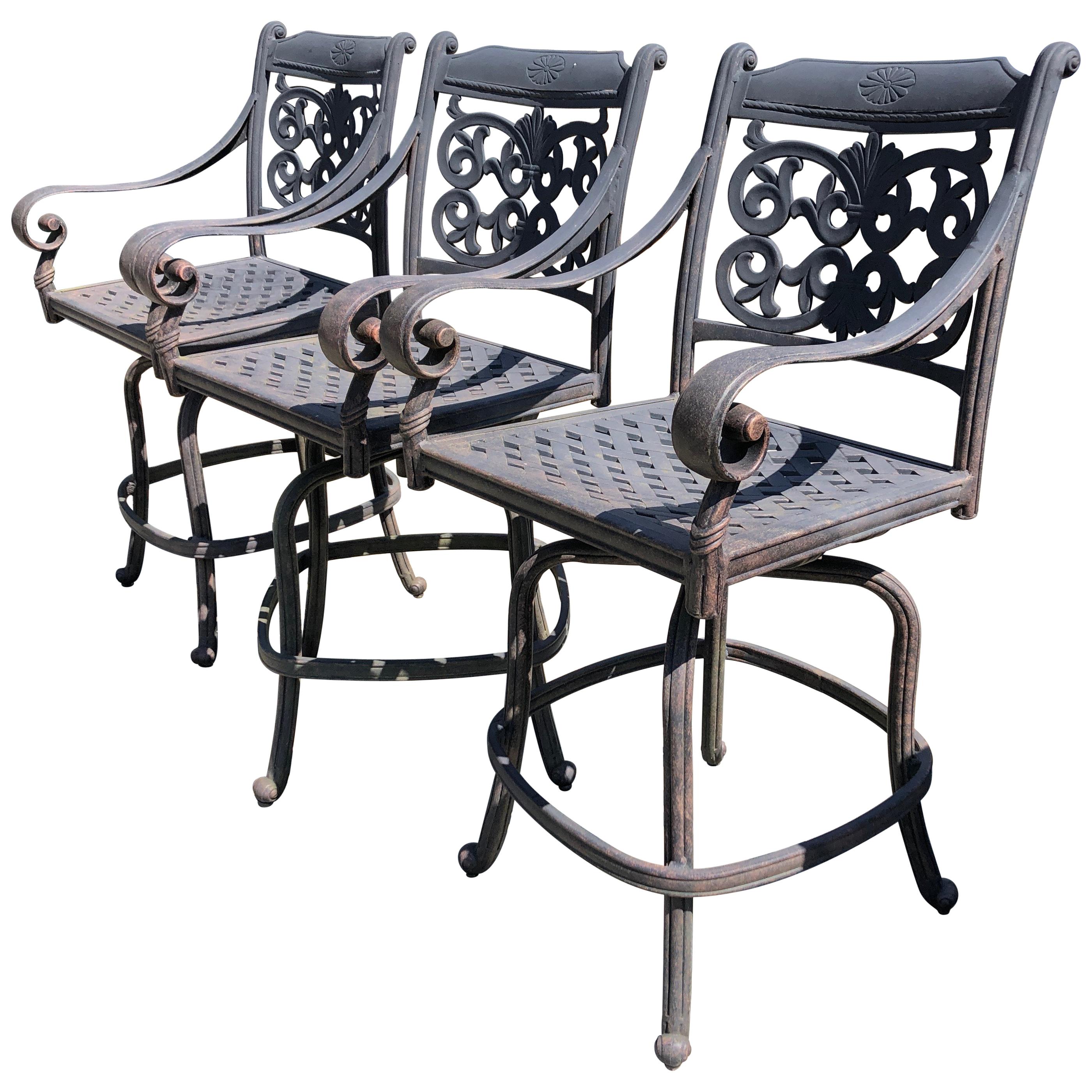 Trio of Handsome Large Outdoor Swivel Cast Aluminum Bar Stools for the Patio
