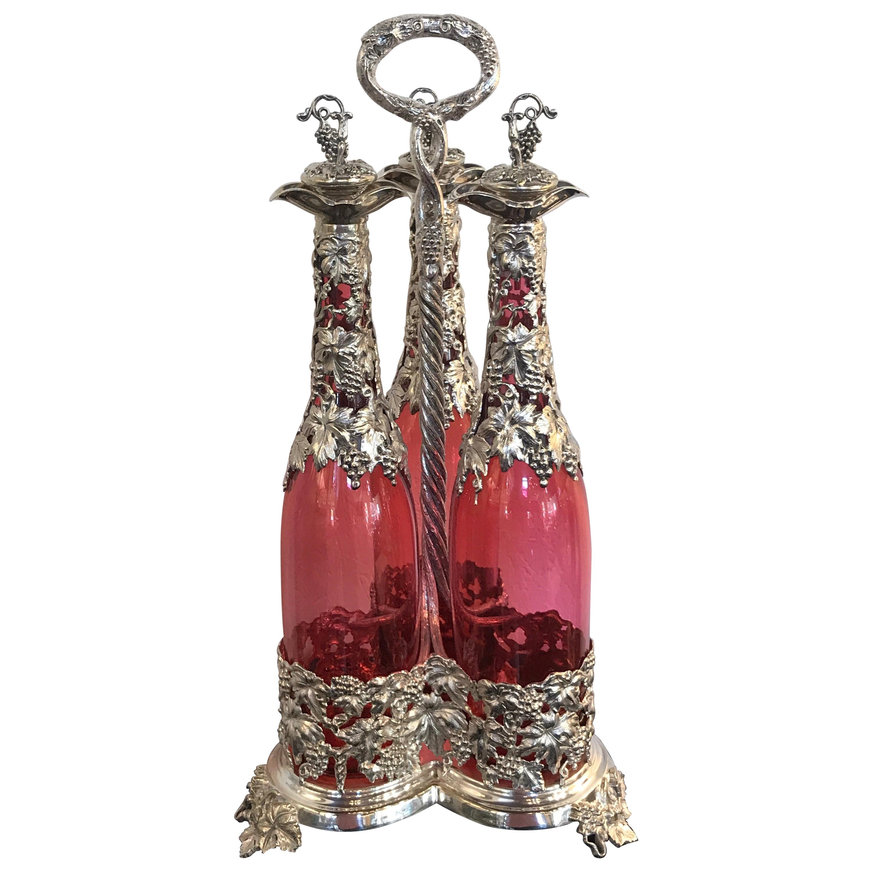 Stunning English Silver Plate and Cranberry Glass Three-Bottle Tauntless For Sale