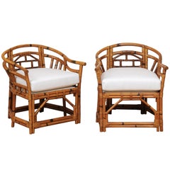 An Exquisite Pair of Horseshoe Back Rattan Club Chairs by McGuire, circa 1975