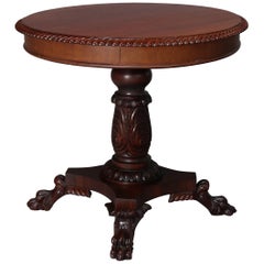 Classical American Empire Carved Mahogany Paw Foot Center Table, circa 1850