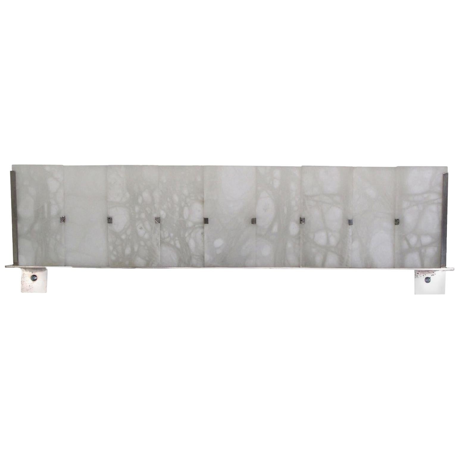 'Ramp' Alabaster Wall Lamp in the Manner of Pierre Chareau

Handcrafted in Los Angeles in the workshop of noted French designer and antiques dealer Denis de le Mesiere, who meticulously pays homage to the work of Pierre Chareau with scrupulous