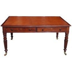 English Mahogany Leather Top Four-Drawer Partners Desk on Casters, Circa 1820