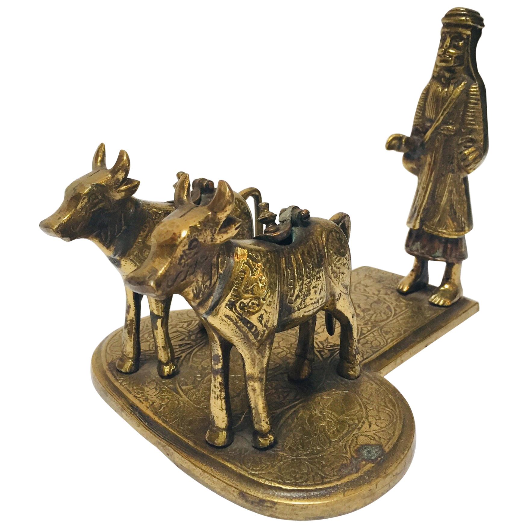 Brass Hindu Temple Oil Lamps Figures a Two Cows and Holly Man Standing For Sale