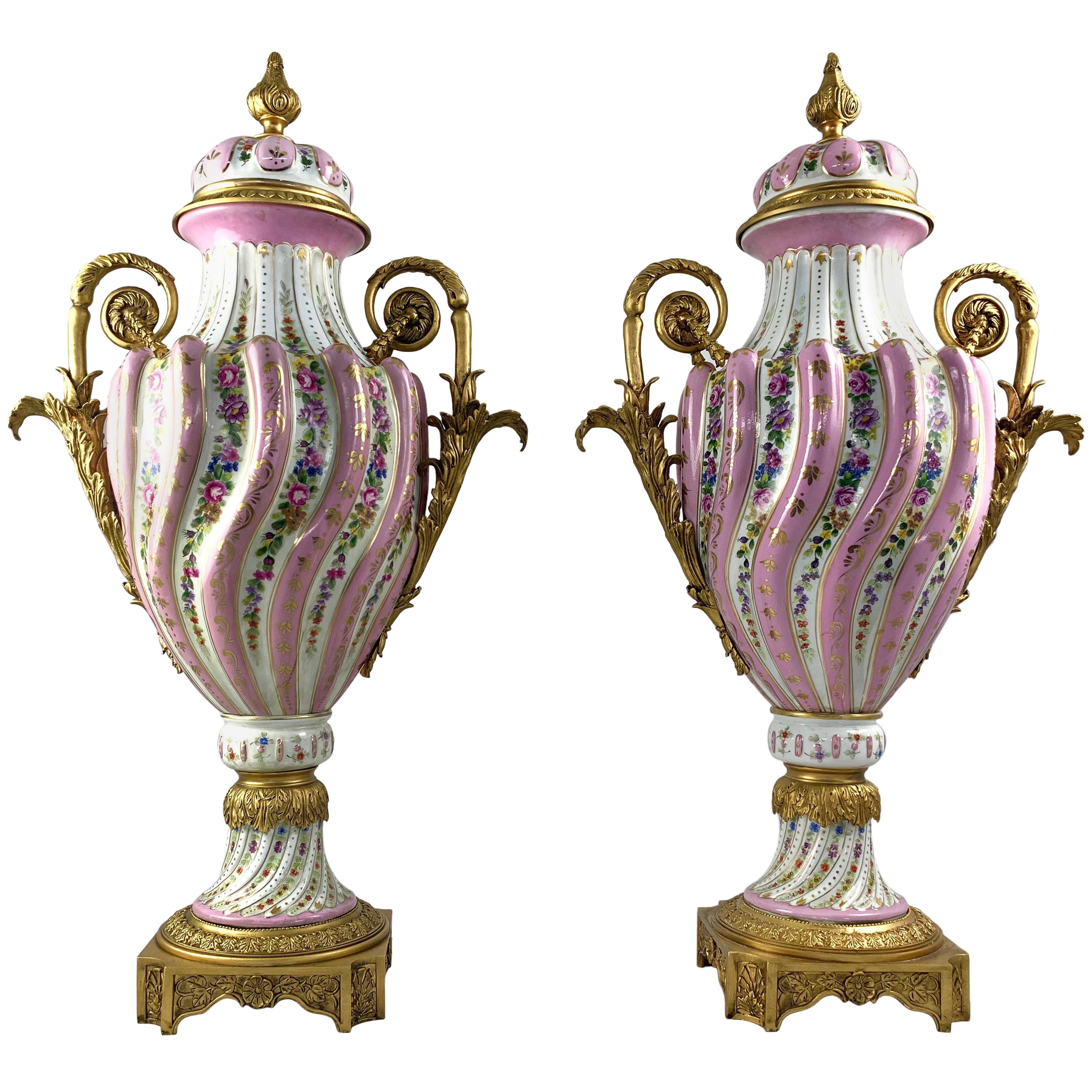 20th Century Pair of Ormolu Mounted Pink Sevres Vases with Lids For Sale