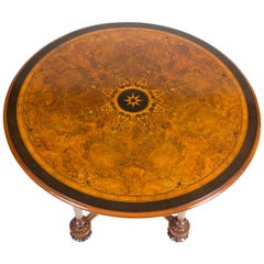 Table circulaire marquetée de motifs classiques