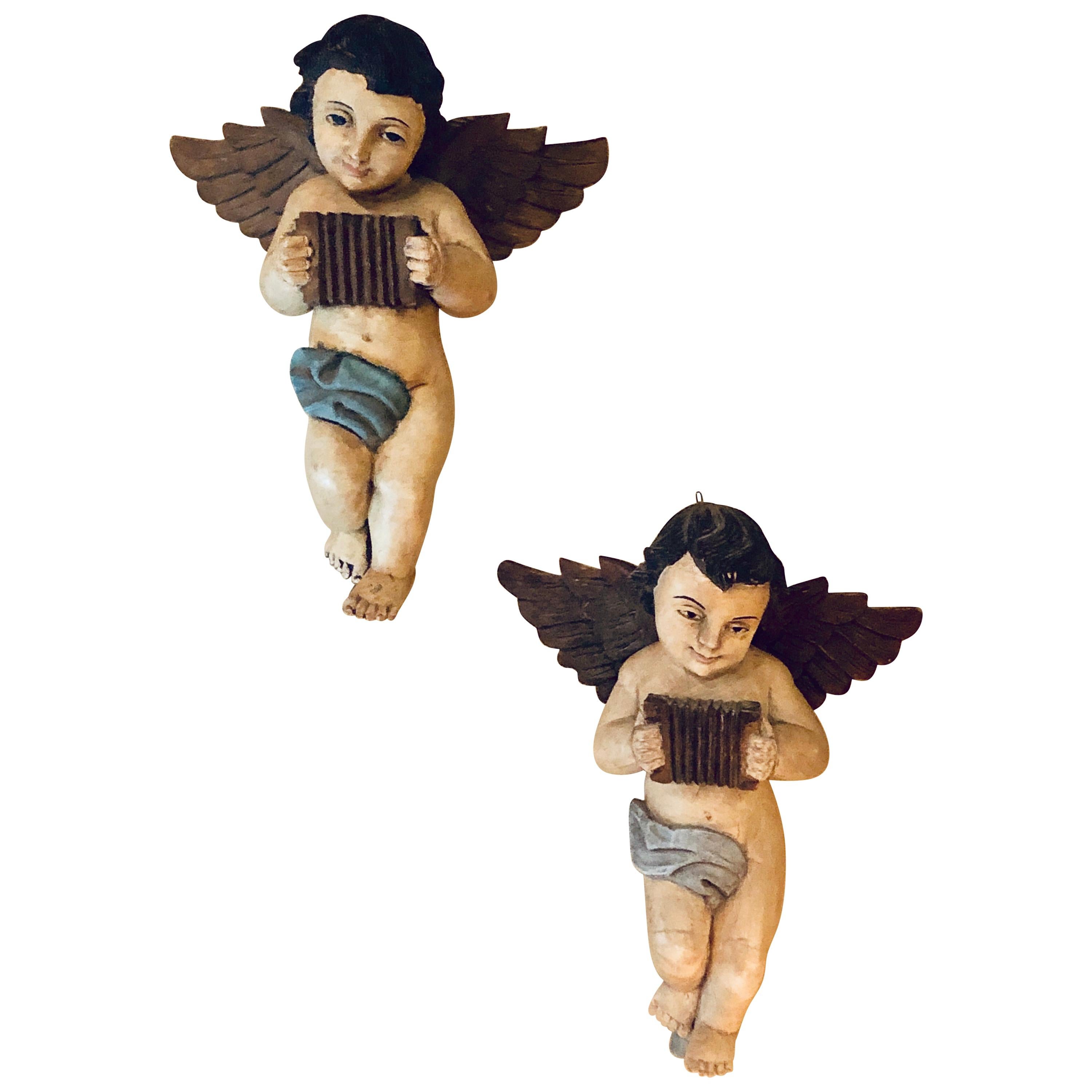 Pair of 19th-20th Century Continental Painted Antique Winged Babies or Cherubs