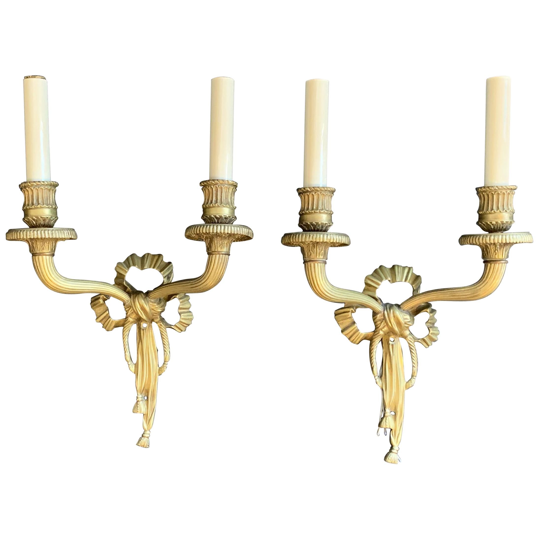 Wonderful French Dore Bronze Pair Caldwell Ribbon Tassel Two-Arm Sconces For Sale