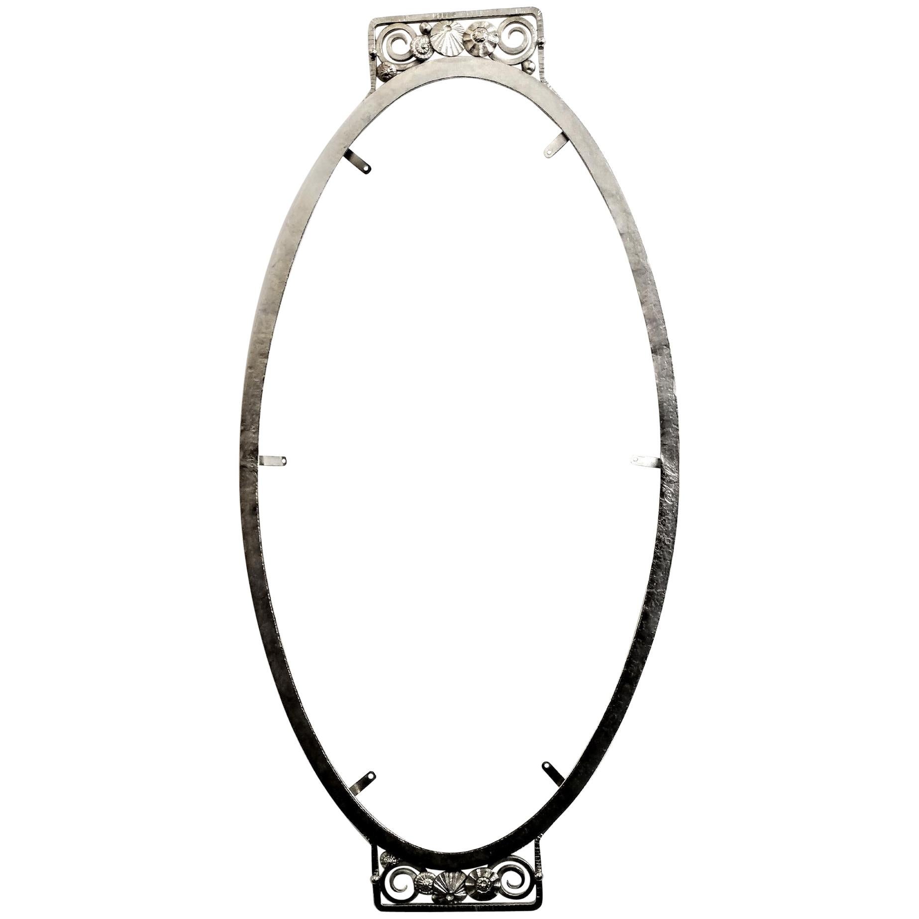 French Art Deco wrought iron mirror frame with intricate geometric flower motif on both ends. The frame has been replated in nickel. The mirror can be used horizontally or vertically. Including a new beveled mirror. We are the rare source that