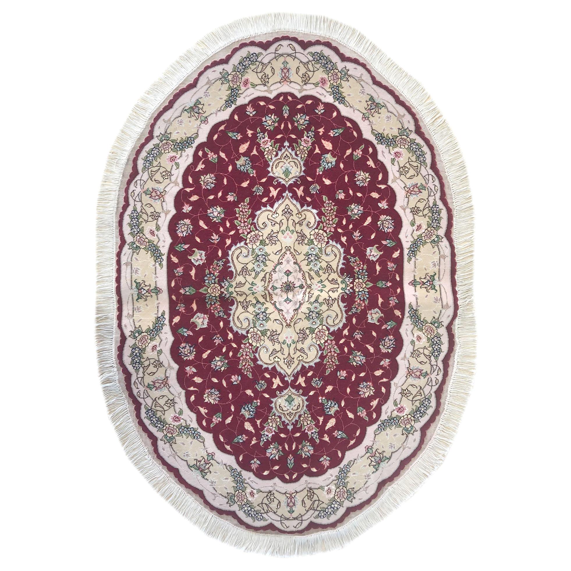 Tapis authentiquement persan, noué à la main, médaillon floral Tabriz rouge, de forme ovale