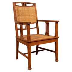 Dutch Colonial Javanese Teak Armchair with Rattan and Triglyph Inspired Motifs