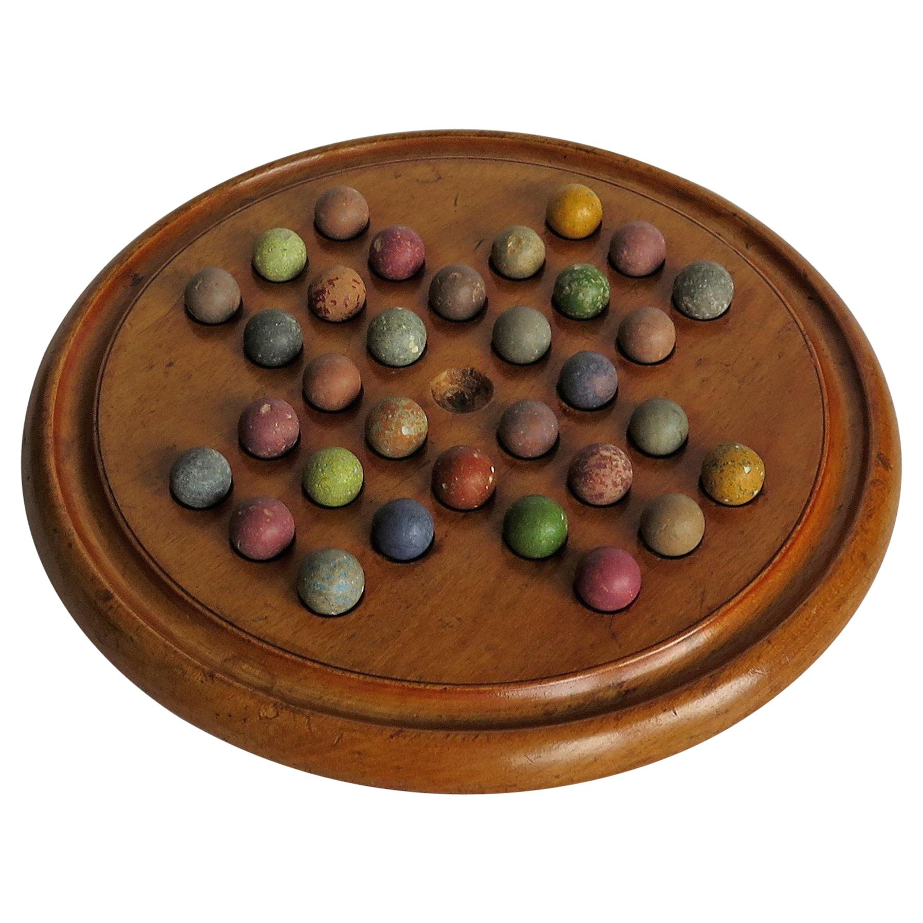 Victorian Marble Solitaire Game with Mahogany Board and 32 Handmade Marbles