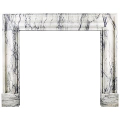 A Baroque Bolection Fireplace Mantel in Italian Pavonazzo Marble