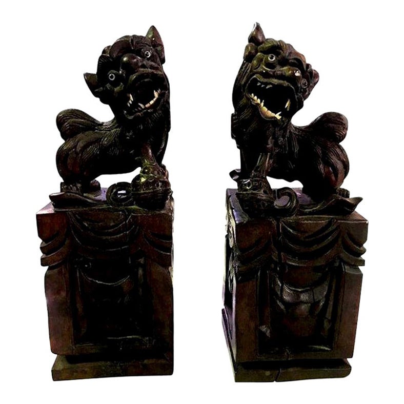 Pair of Hand Carved Chinese Wood Carved, Bone Inlay Foo Dogs, circa Early 1900s For Sale