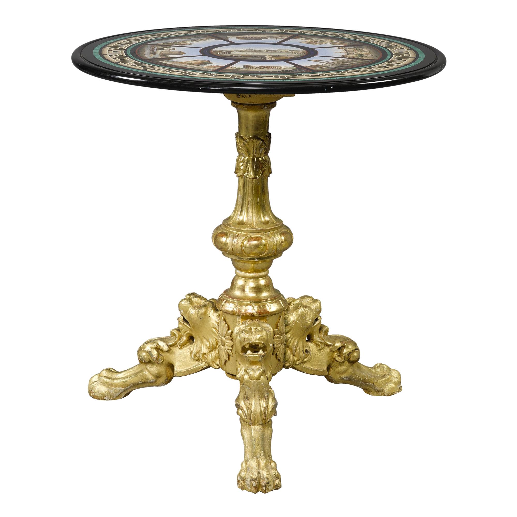 An Important and Rare Italian micromosaic table by Cesare Roccheggiani on a giltwood tripod base, Rome, last quarter 19th century.
The central panel depicting St. Peter's Square surrounded by eight views of Roman monuments within lapis lazuli,