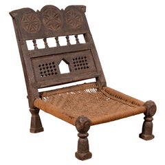 Indian Antique Rustic Low Seat Wooden Chair with Carved Rosettes and Rope Seat