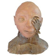 Escultura surrealista de mediados de siglo con busto de terracota