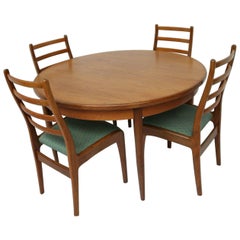 Table et chaises de salle à manger à rallonge du milieu du siècle en teck et bois de rose de Ib Kofod-Larsen
