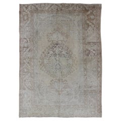 Earth Tones Vintage Turkish Oushak Rug with Faded Colors in Medallion Design