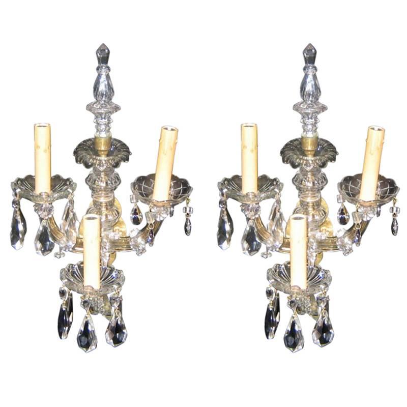 A pair of circa 1930's French cut crystal sconces with crystals.

Measurements:
Height: 17