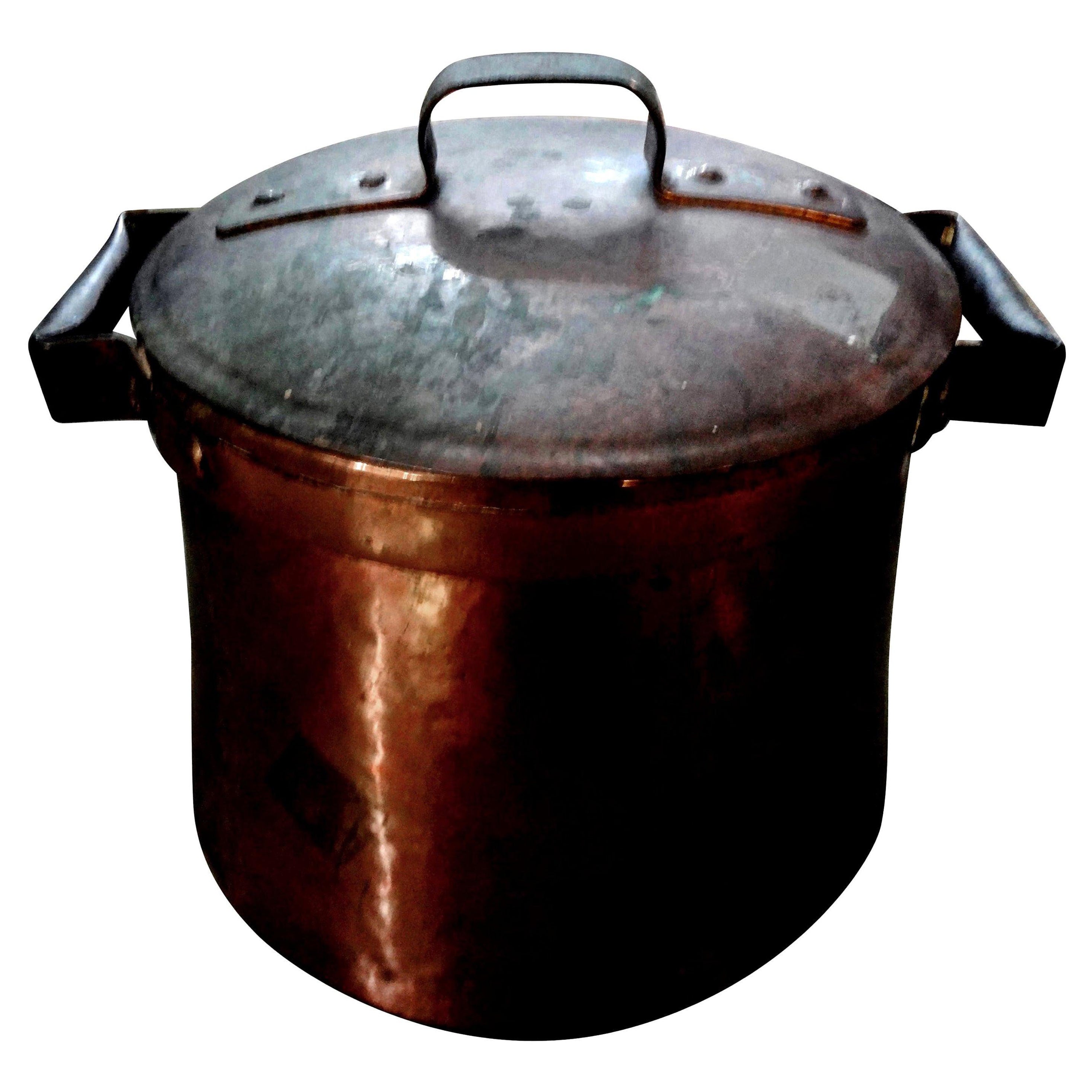 19th century French copper pot with lid.
Beautiful 19th century French Provincial copper cooking pot with original lid. This French piece has not been polished and makes a great decorative accessory, centerpiece or wine cooler.  