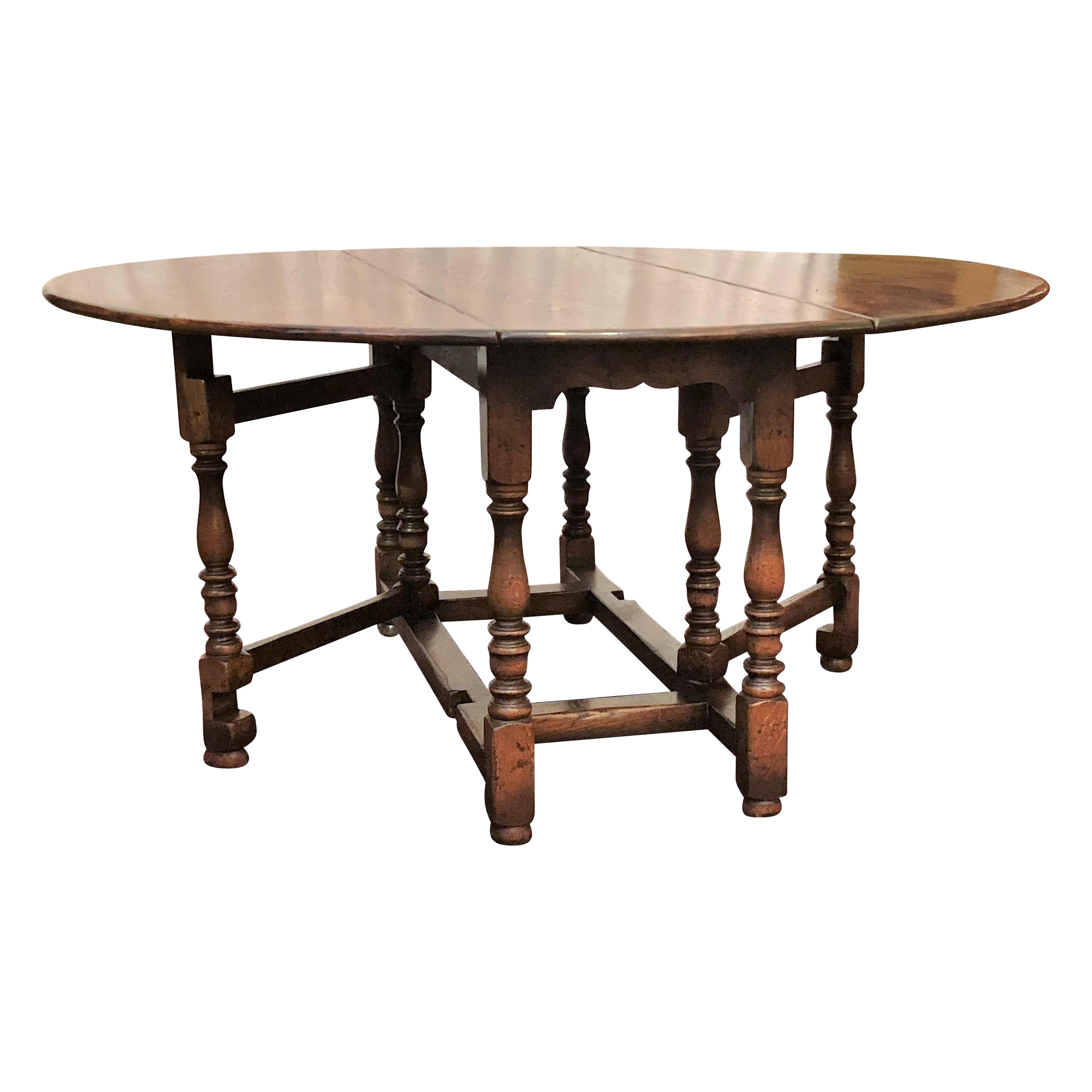 English Drop-Leaf Yew Wood Round Table For Sale