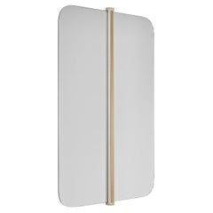 GABRIEL mirror with brass color detail on center and rounded ends