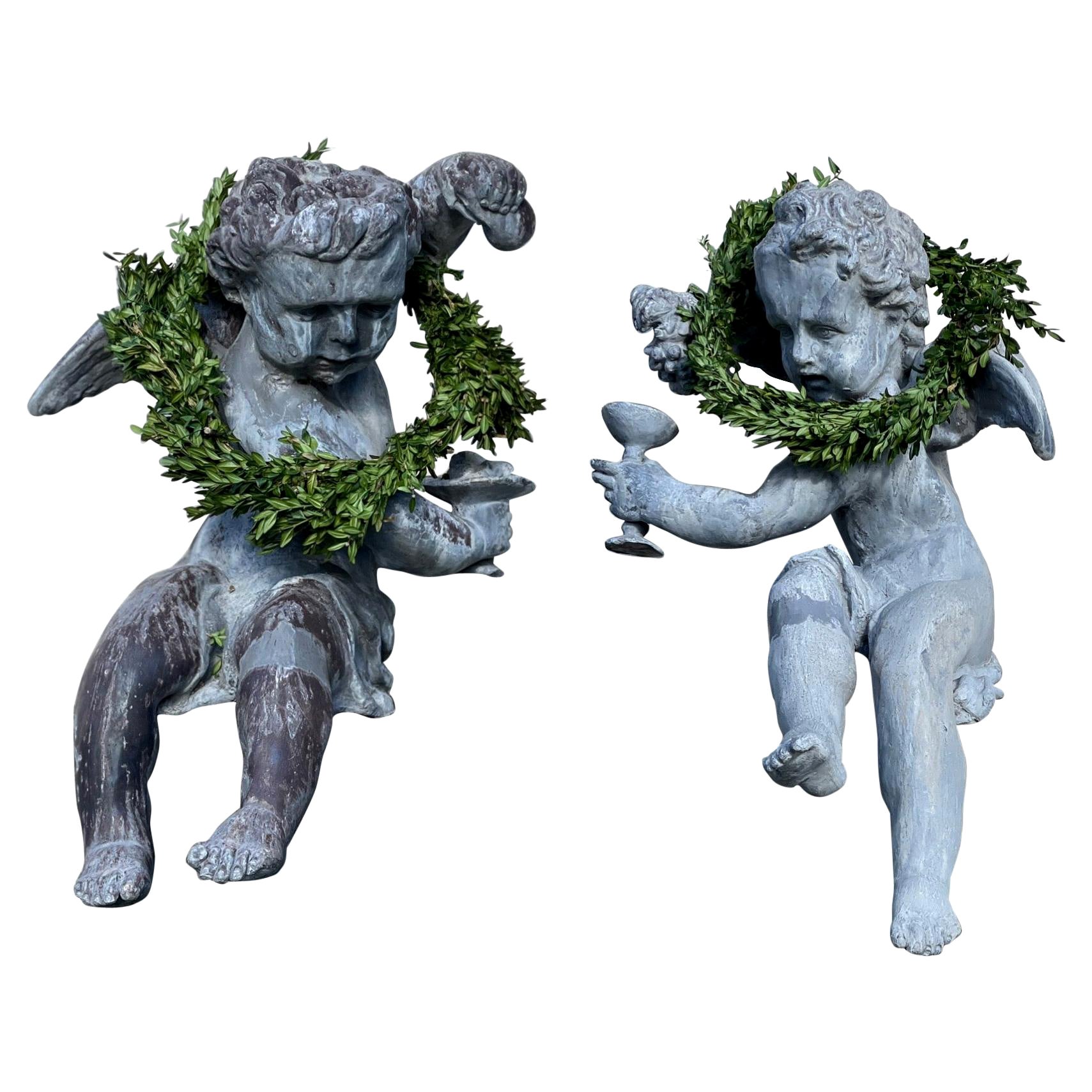 Pair of French Lead Bacchus Putti Seated Garden Figures