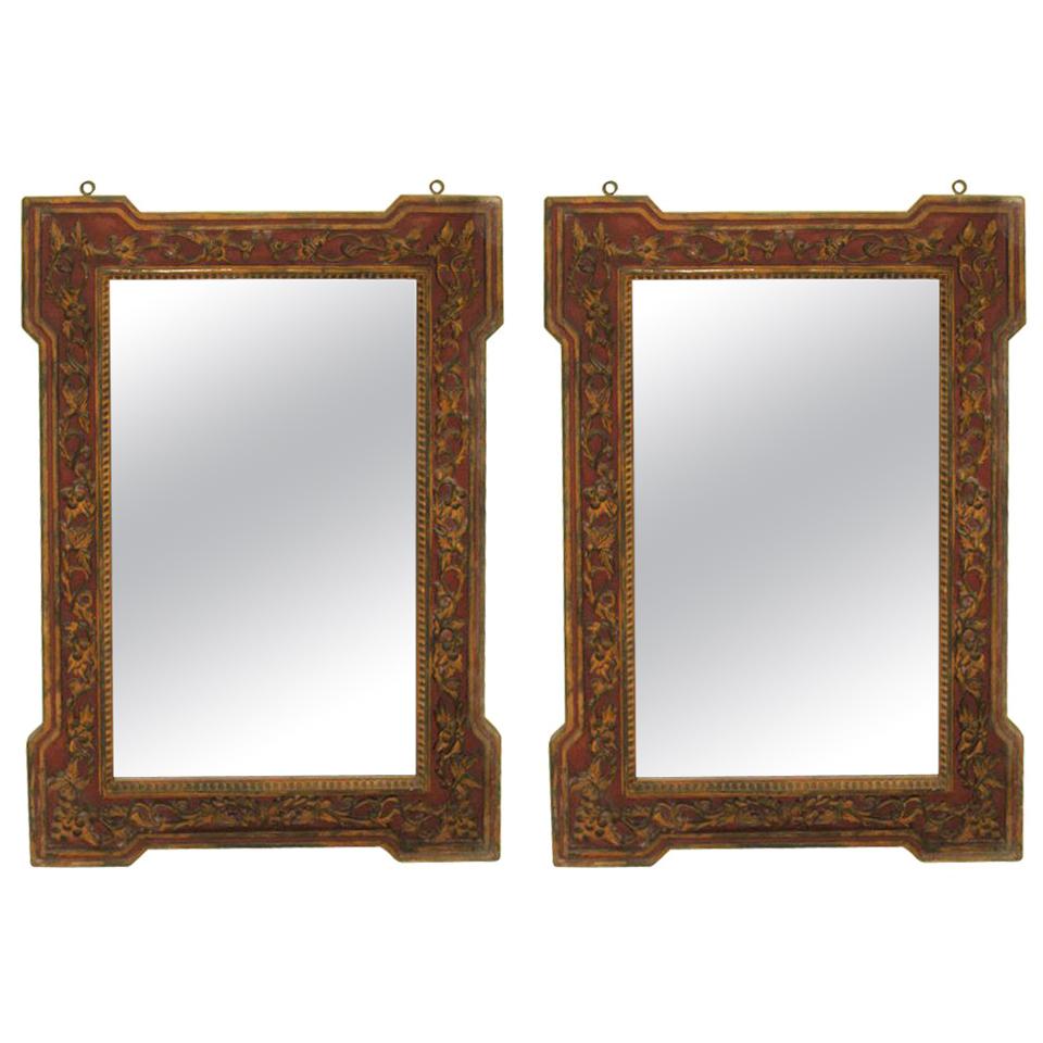 Pair of rare and large late Qing dynasty (1644-1911/12) wall mirrors. Each with deep hand carved decoration in Classic traditional nature motifs with deeply carved inset floral decoration. Both are hand painted in Classic Chinese copper red /