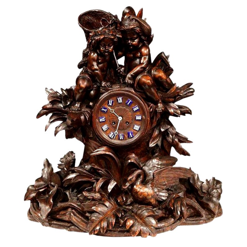 19th Century Swiss Black Forest Carved Walnut Mantel Clock with Cherubs and Bird