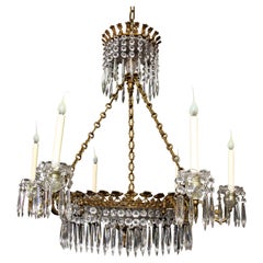 Grand lustre ancien de style Régence anglaise en bronze doré et cristal