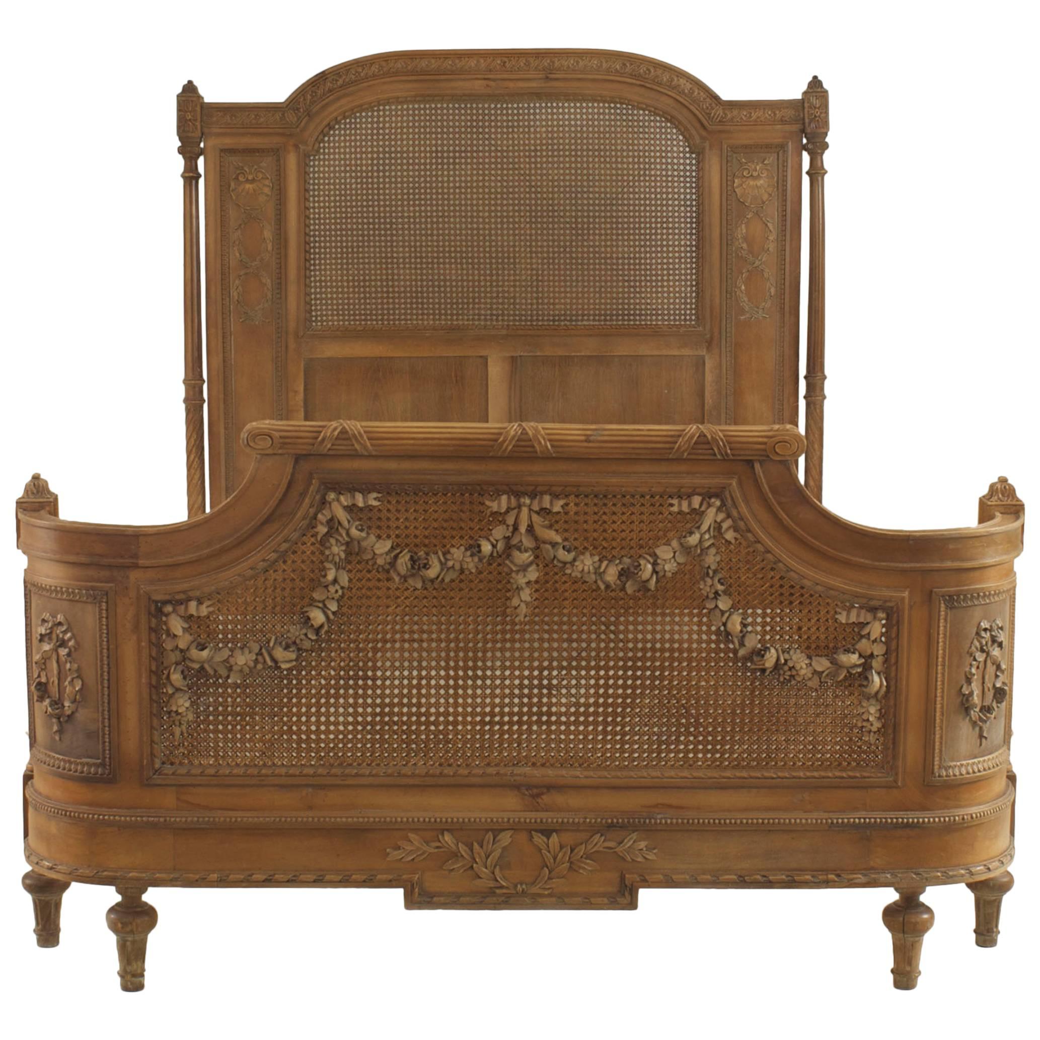 French Louis XVI Style Carved Walnut and Cane Bed