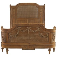 French Louis XVI Style Carved Walnut and Cane Bed