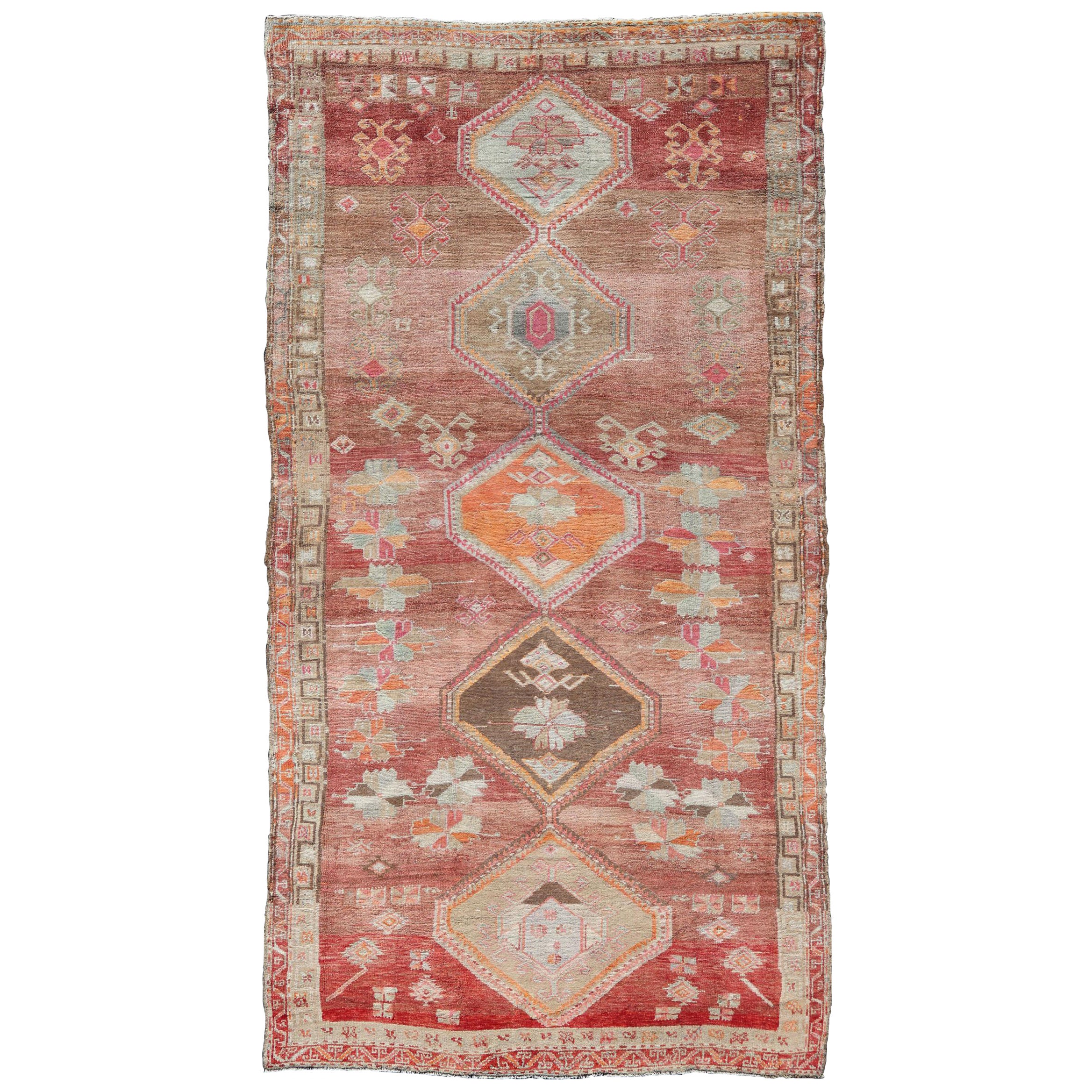 Long Rug, Vintage Turkish Gallery Rug with Tribal Design in Variegated Red For Sale